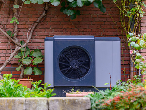 heat pump installed outside a residential home.