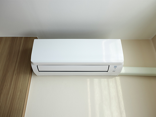 Closeup of ductless mini-split system interior wall unit.