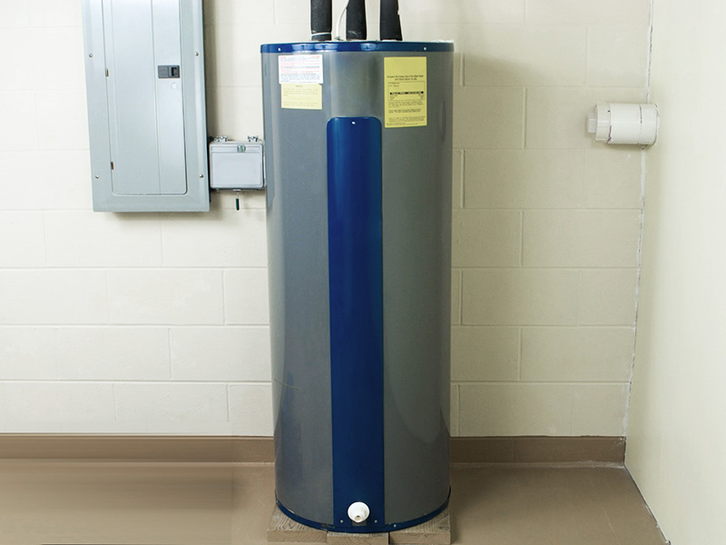 Heat pump water heater in a utility room.